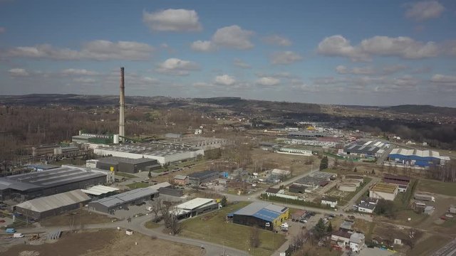 Gorlice, Poland - 3 9 2019: Industrial region of the Carpathian city. Top view of the refinery and auxiliary buildings. Video shot by drone or quadrocopter. Vanity of the day at the factory. Planning 