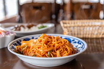 Italian noodles spaghetti pasta with tomato sauce served in beatiful dish.