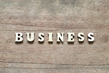 Letter block in word business on wood background