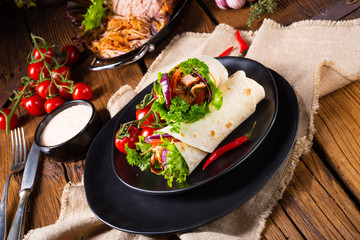 Tasty wraps filled with pulled pork and salad