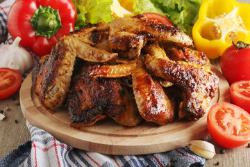Chicken wings barbecue with different vegetables