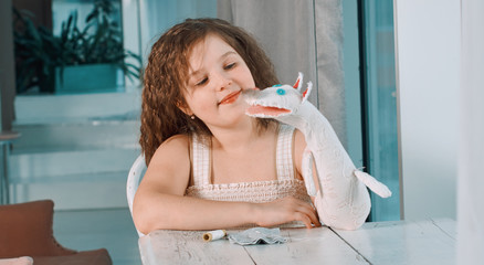 small girls with hand puppets