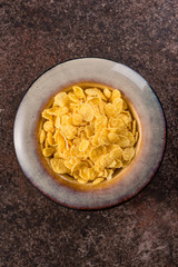 Cornflakes in a ceramic plate.