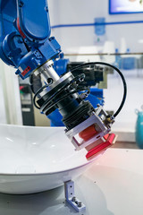 robot arm is working smartly in sink department in artificial intelligence factory