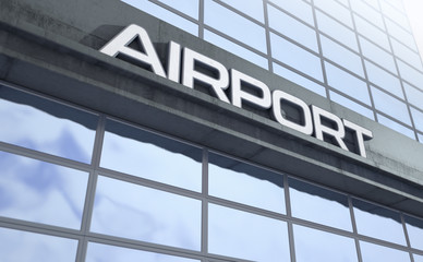 Signage above the entrance to a modern generic airport building made of exposed concrete and...