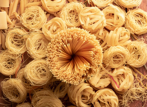 top view different types, colour of pasta and geometric shape on the table