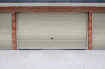 Roll steel door or Shutter door and concrete floor outside building of home car parking.