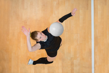 Upper View of Female Volleyball Player at Service