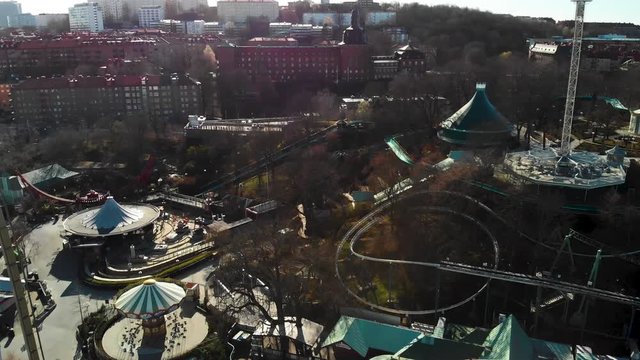 Aerial footage over Liseberg amusement park in Gothenburg. Most fun in Sweden. Also showing Guldheden and Johanneberg in the background.