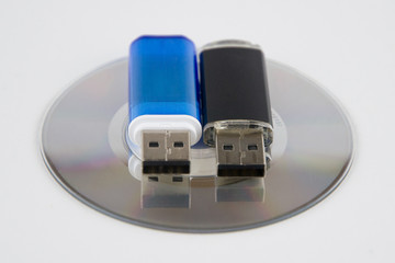 industrial espionage: small CD-ROM, 2 USB sticks, isolated on white