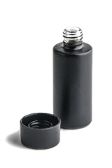 elegant black open perfume bottle, the lid lies next. Isolated on white, front view