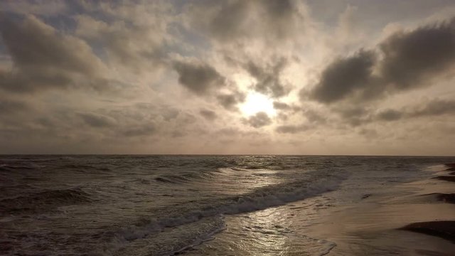 Amazing golden hour and cavum cloud view at the shore with dramatic light effects and awesome cloudscape