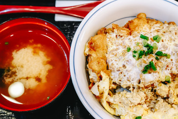 Closeup Japanese food ,Katsudon is Japanese fast food (bowl of rice topped with fried pork cutlet and eggs with soup)
