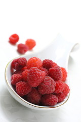 Red raspberry on white background. 