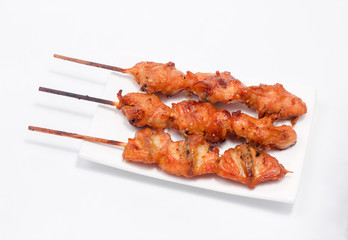 Chicken butt grilled on white plate isolated on white background