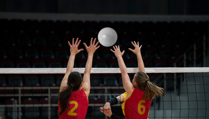 volleyball game sport with group of girls indoor in sport arena