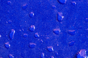 Water droplets on blue tiles