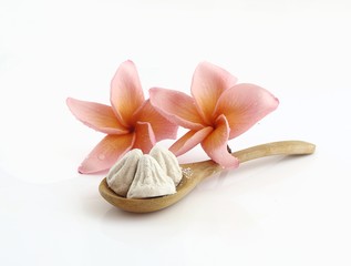 Fototapeta na wymiar White clay filler on wooden spoon for Thai songkran festival