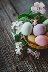 Obraz na płótnie Canvas Easter eggs on wood background