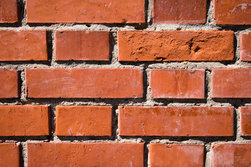 Obraz premium Fragment of new smooth red brick wall. Abstract texture background