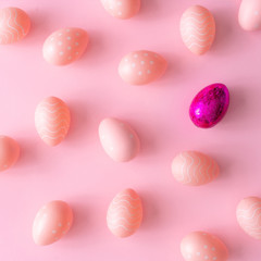Pink Easter eggs on pink table. Minimal Easter background composition. Flat lay.