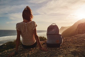 Tourist girl with backpack enjoying the view.