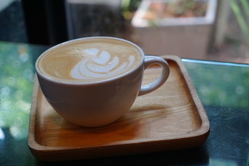 Hot coffee with texture on top of crema