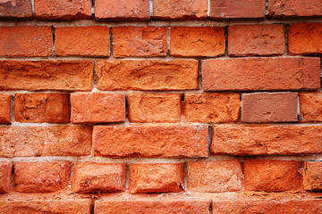 Texture of stones and cobblestones. Very old, crumbling brick wall