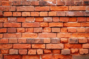 Texture of stones and cobblestones. Very old, crumbling brick wall