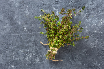 Bunch fresh thyme dark background top view