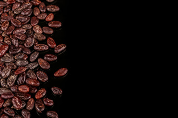 Cocoa beans  isolated on black background. Roasted beans. 