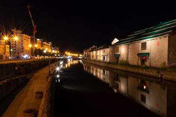 Fototapeta na wymiar Landscape view of Otaru canals and warehouse at night in Hokkaido Japan. Here is a famous landmark of Otaru city.