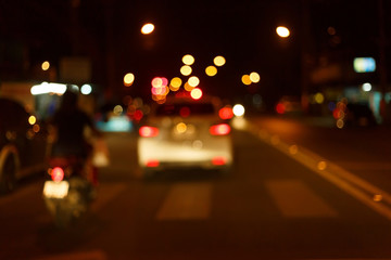 traffic light of driving car on city night street road, abstract blur bokeh background