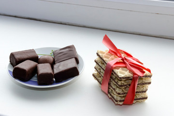 cookies tied with red ribbon and chocolate candy