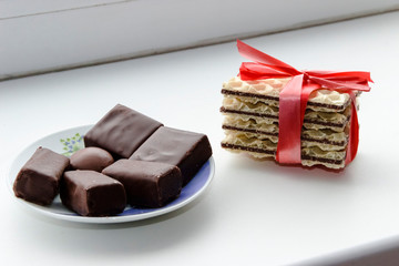 cookies tied with red ribbon and chocolate candy