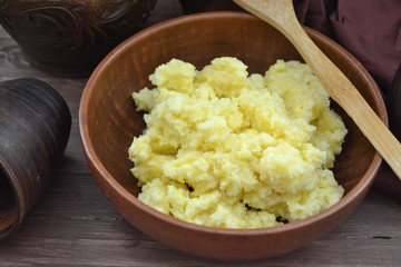 Organic healthy breakfast. Russian cuisine with millet and maize porridge close up