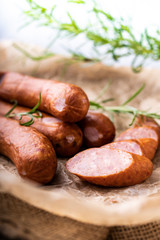 Thin sausage in composition with herbs, smoked sausage.