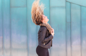 Beautiful young woman play her hair