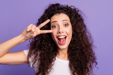 Close up photo amazing her she lady scream yell shout wave wealth hair lying shoulders show v-sign hand arm near eye wear casual white t-shirt clothes outfit isolated violet purple bright background
