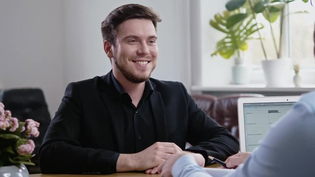Confident young man attending job interview