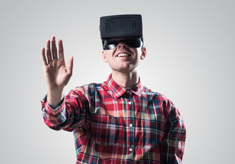 Guy in mask experiencing virtual reality as new entertainment device