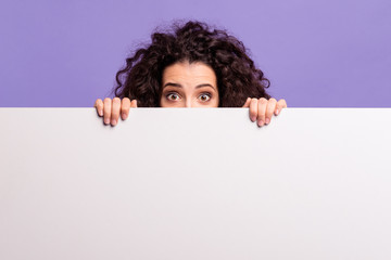 Portrait of her she nice attractive cheerful amazed brunette wavy-haired lady showing hiding behind...