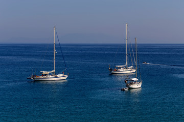 The yacht sails moored on the open sea (region of Epirus, Greece)