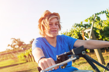 Young farmer riding quad bike © adam121