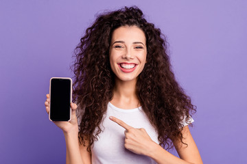 Close-up portrait of nice cute attractive winsome lovely cheerful wavy-haired lady showing new...