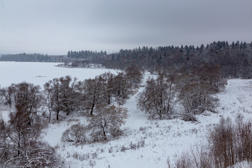 Winter landscape. River valley under the snow.