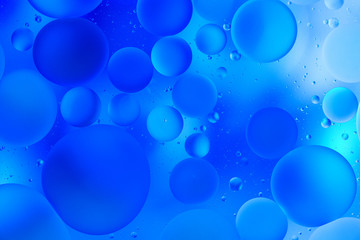 water drops on glass with blue background, close-up 