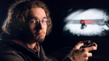 Man holding a Gamepad, he has sad expression