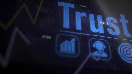 Trust business concept on a flashing computer monitor with moving graphs and data.