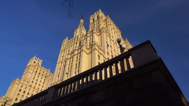 Panoramic overview, from left to right, of the facade of the old Stalinist skyscraper. Beautiful architecture Sculptures and stucco as elements of the decor of the building. Ultra HD stock footage